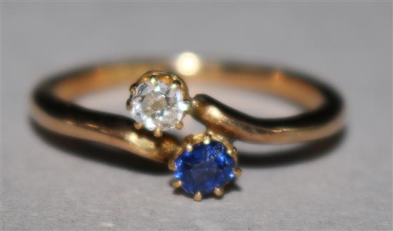 A gold sapphire and diamond crossover ring, size L.